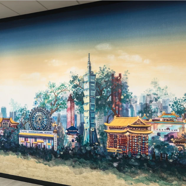 A painted mural of the Taipei skyline with Taipei 101, temples and the old airport building.